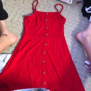 A red flowy dress with buttens